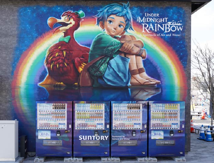 The Under the Midnight Rainbow characters emerge on a canvas that merges a wall with vending machines!